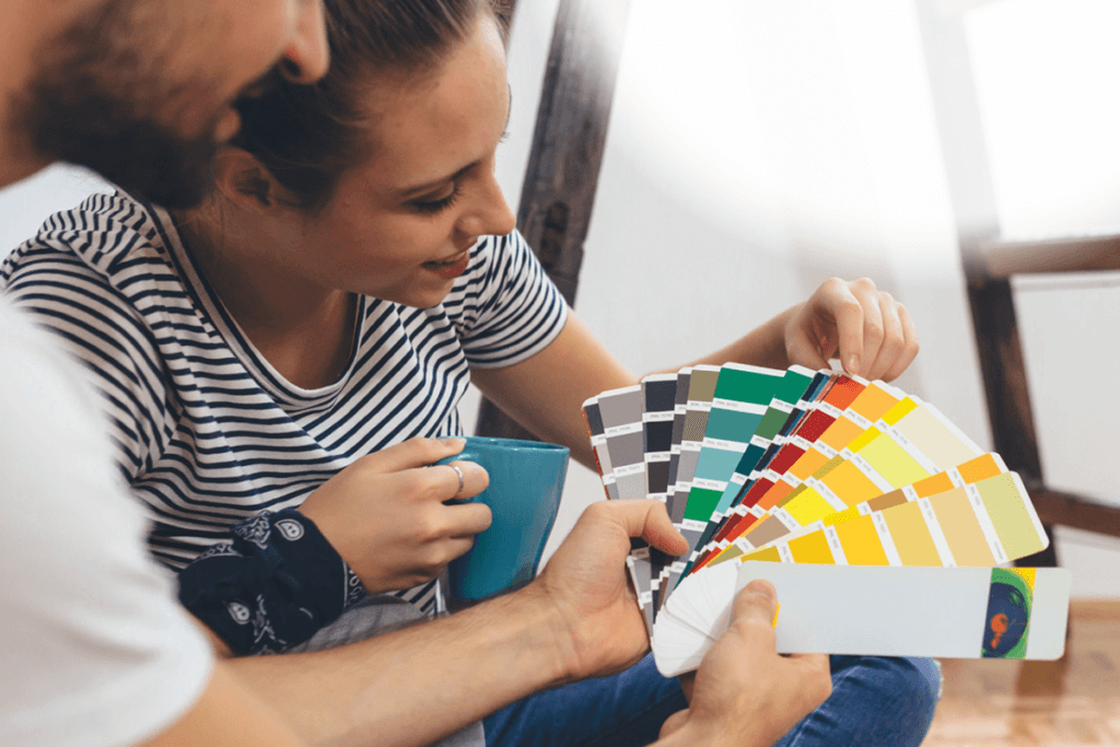 Husband and wife picking out paint colors
