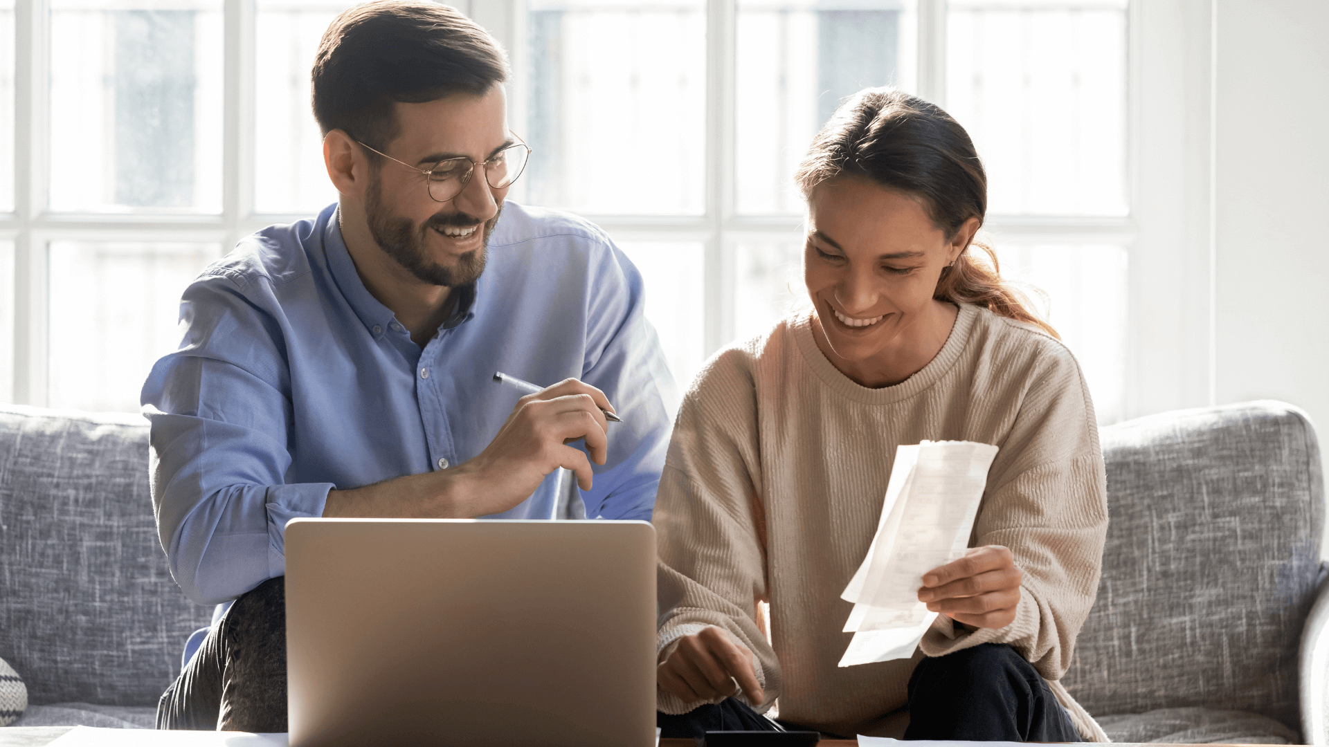 couple looking over bills together